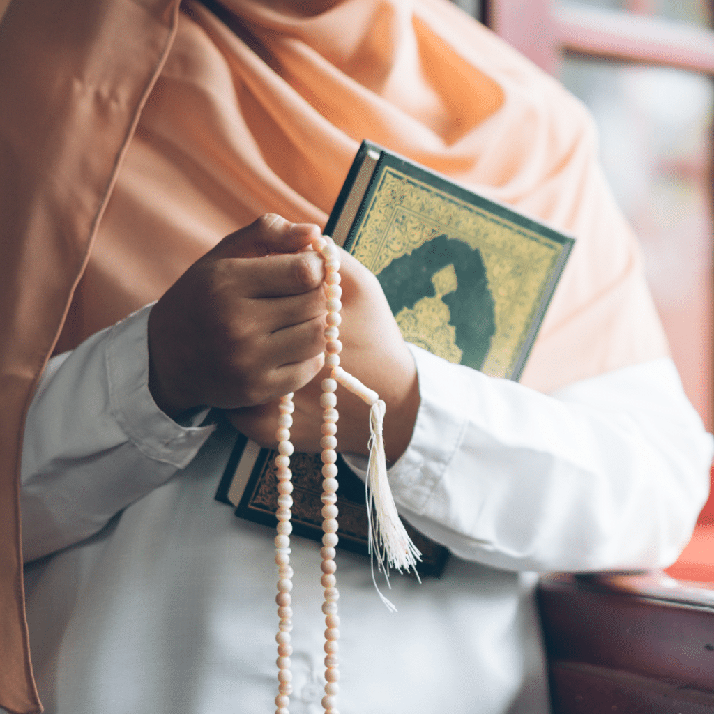 a muslim woman holding a quran